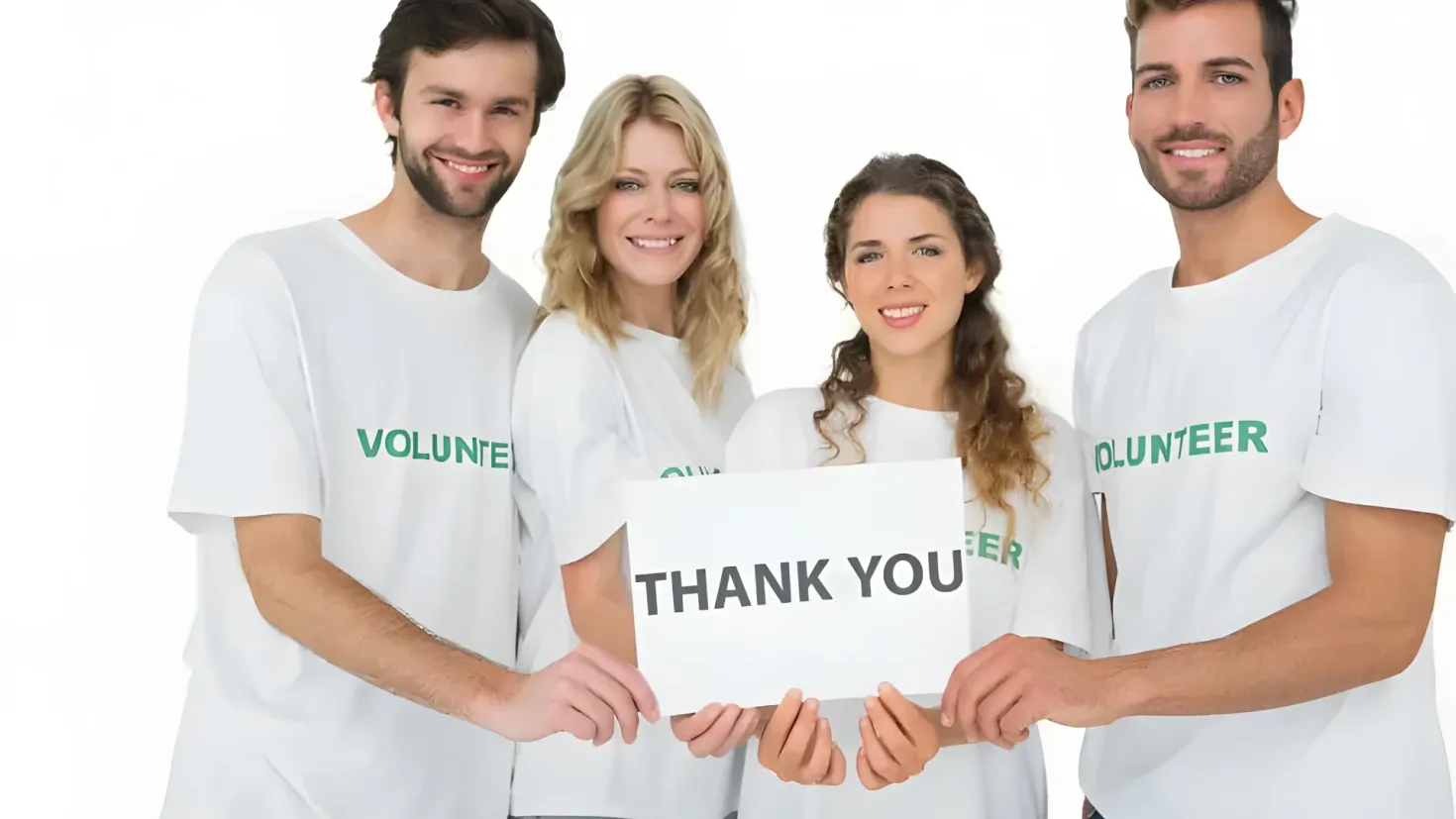 A group of four people wearing white t-shirts with the words "Thank You" printed on them, standing and smiling against a white background.