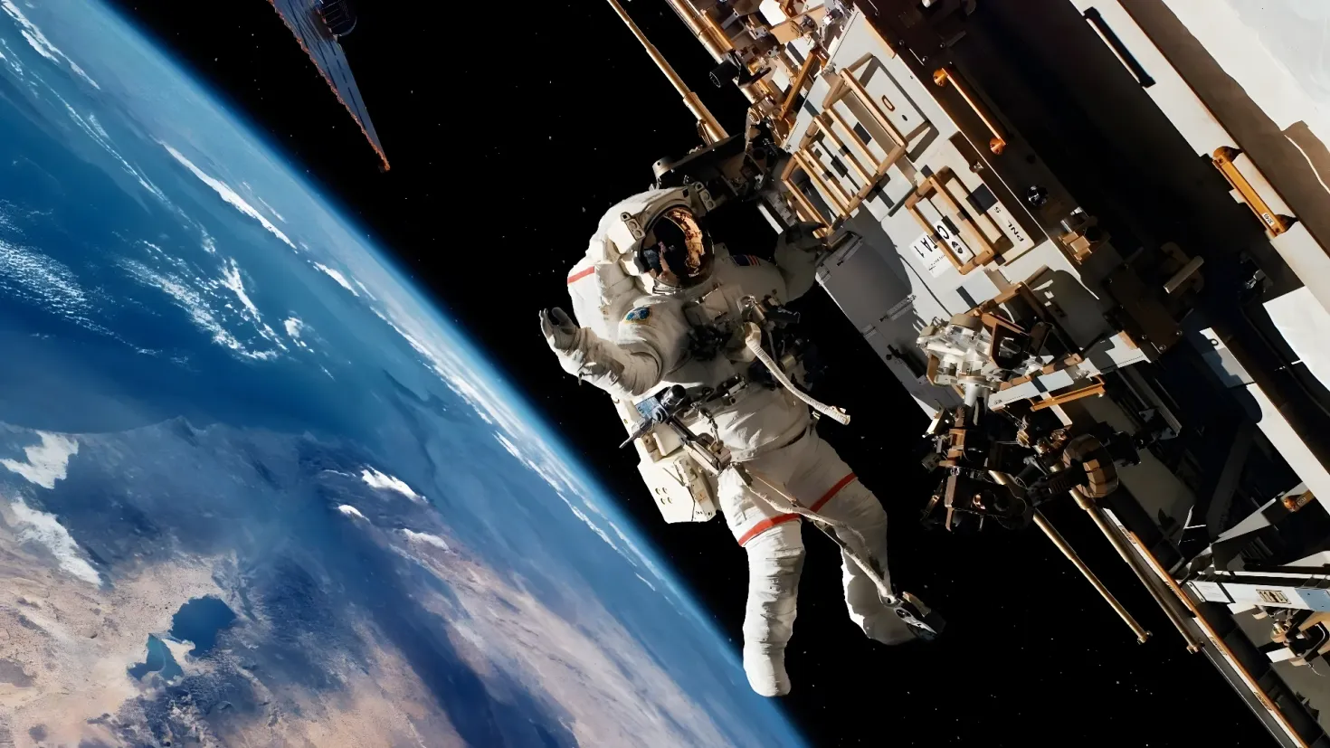 An astronaut floating in space with the Earth in the background. The astronaut is wearing a white space suit and is surrounded by the vast expanse of the sky and the Earth. On the right side of the image, there is a building, likely part of the International Space Station.