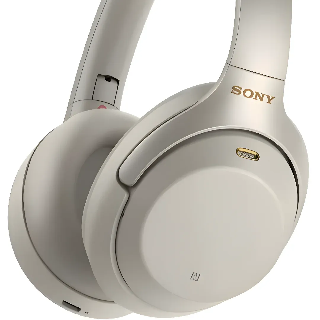 A pair of white Sony WH-1000XM4 Wireless Noise Cancelling Headphones. The headphones have a sleek design with a comfortable fit and are equipped with noise cancelling technology for superior sound quality.