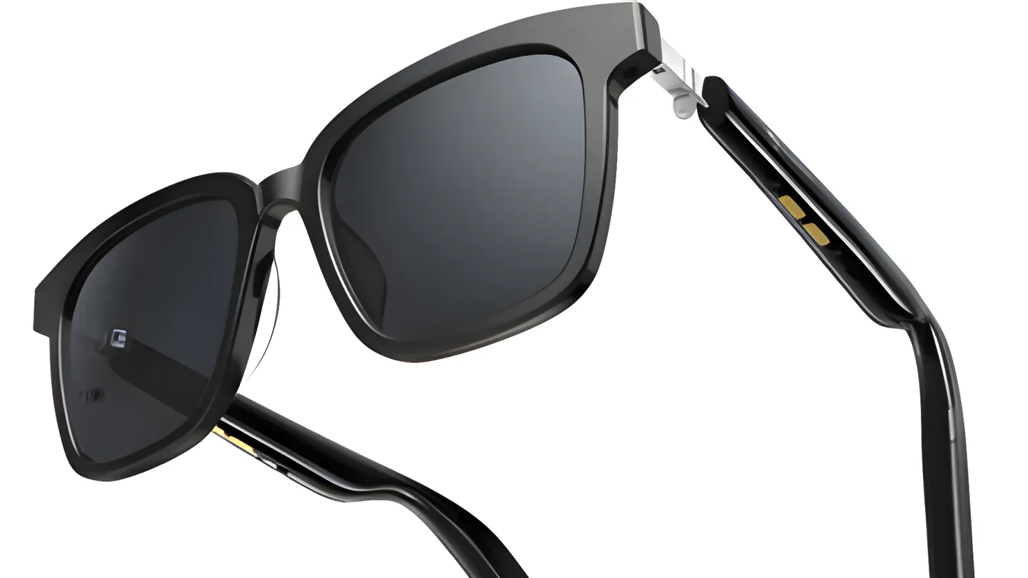 A pair of black sunglasses on a white background. The sunglasses have a sleek, modern design with a glossy black frame and dark lenses. The arms of the sunglasses are thin and curved, giving them a stylish and sophisticated look.