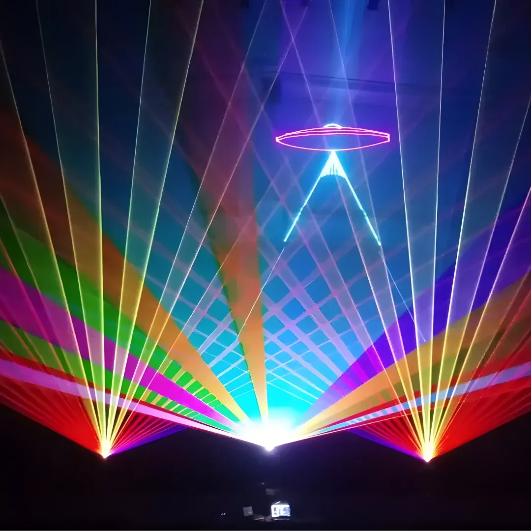 A colorful laser light show in the middle of a dark room, illuminated by a variety of lights in different colors. At the bottom of the image, there are various objects, likely related to the laser show.