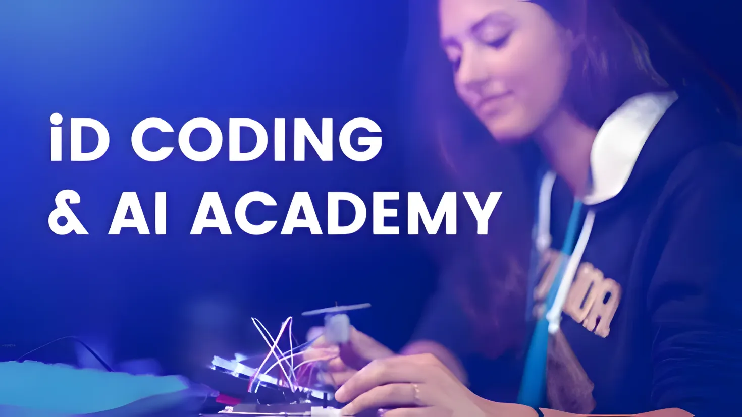 A woman wearing a stethoscope and holding an object in her hand, with a table in front of her with various objects on it. In the middle of the image, there is text that reads "id coding & ai academy".